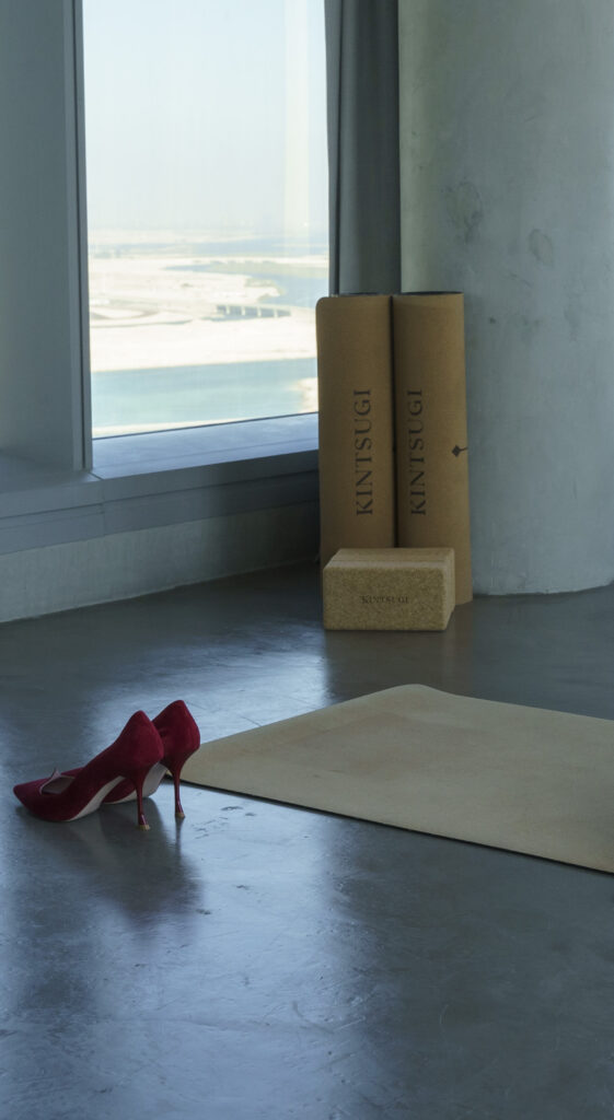 A white room, with Kintsugi products in the distance