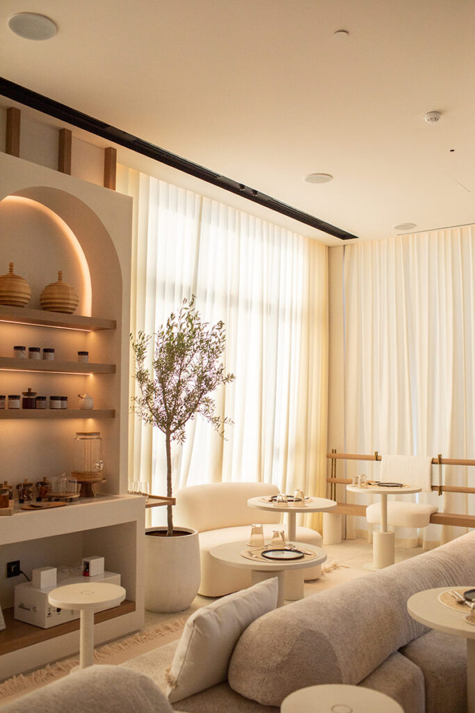 A white room, with Kintsugi products in the distance